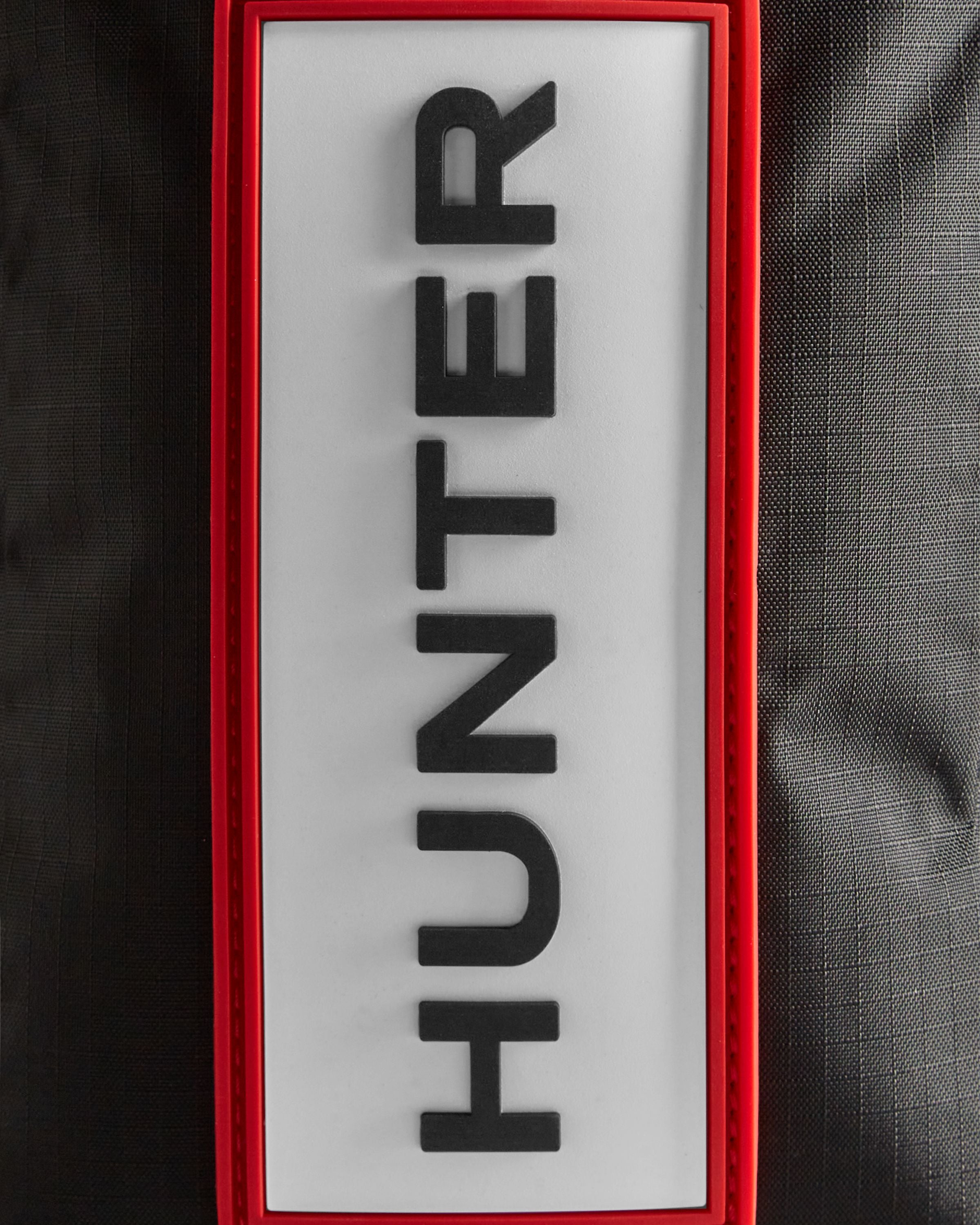 トラベル リップストップ リサイクル ナイロン フォンポーチ - ブラック/レッド ボックス ロゴ